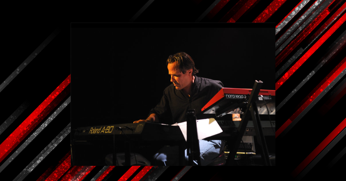 George Whitty playing keyboards